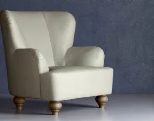 Poltrona dalle forme arrotondate in pelle con piedini in legno Sara di Doimo Salotti